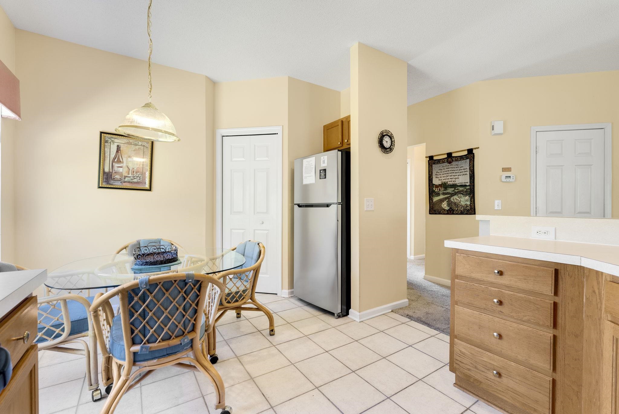 4499 Girvan Drive, Unit H Myrtle Beach, SC 29579 - Photo 21 of 35 Dining space with light tile patterned floors and baseboards