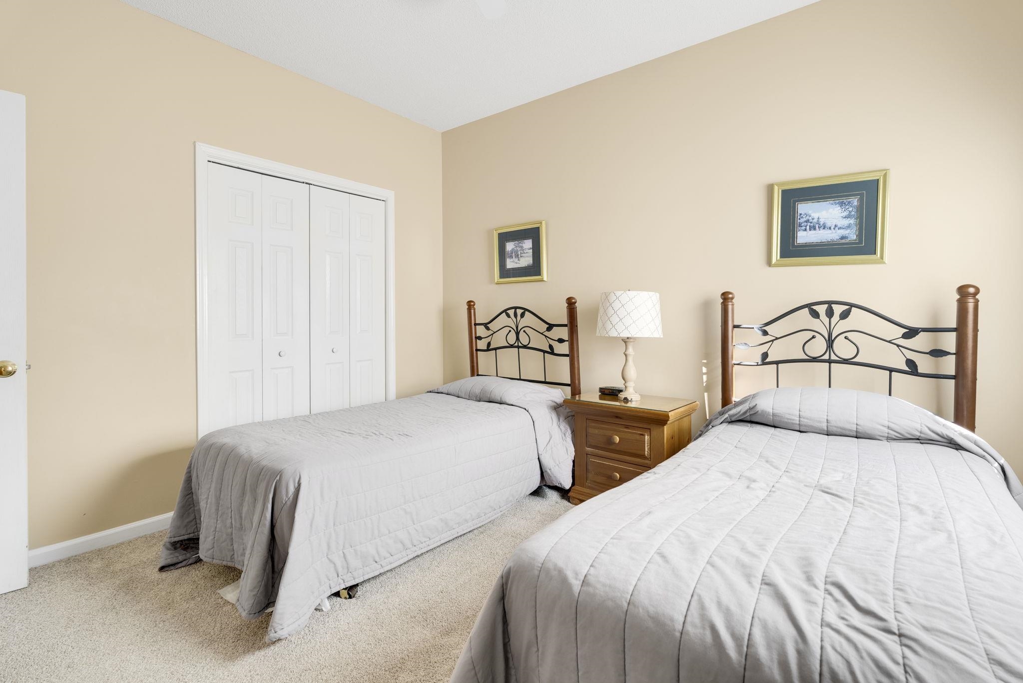 4499 Girvan Drive, Unit H Myrtle Beach, SC 29579 - Photo 23 of 35 Carpeted bedroom with a closet and baseboards