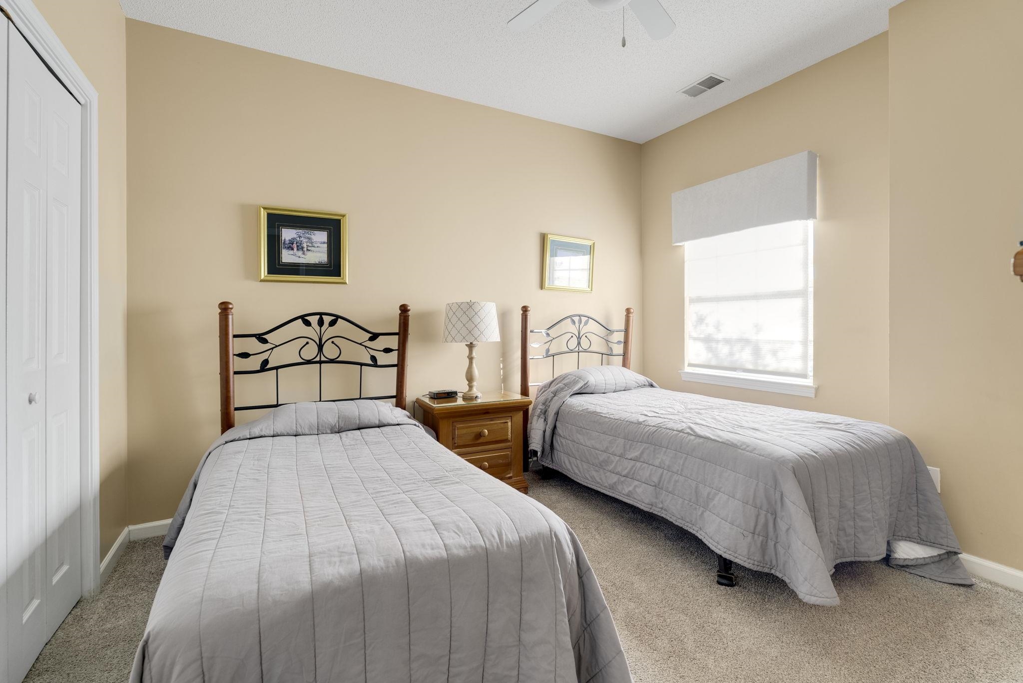 4499 Girvan Drive, Unit H Myrtle Beach, SC 29579 - Photo 25 of 35 Bedroom with carpet flooring, a closet, and ceiling fan