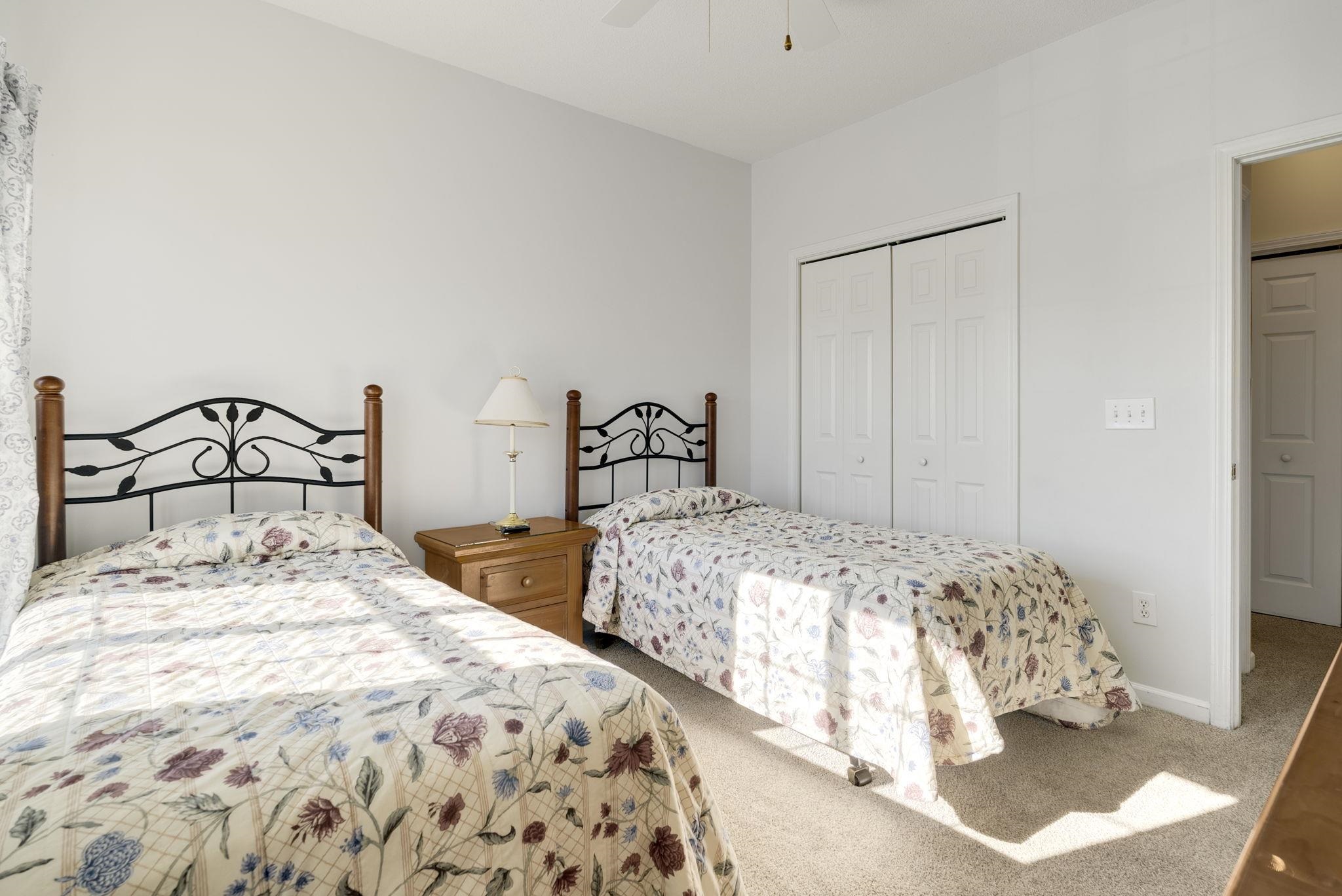 4499 Girvan Drive, Unit H Myrtle Beach, SC 29579 - Photo 27 of 35 Carpeted bedroom featuring a closet and ceiling fan
