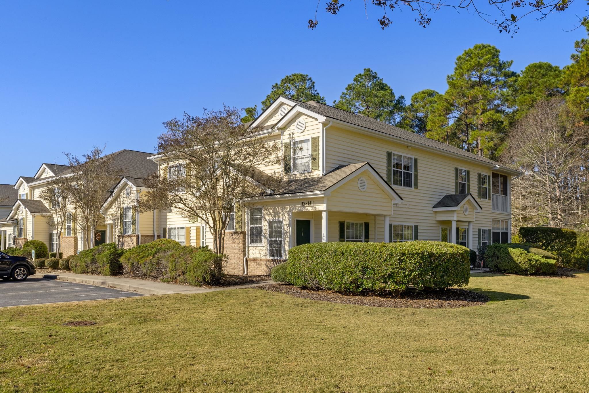 4499 Girvan Drive, Unit H Myrtle Beach, SC 29579 - Photo 3 of 35 View of front of property featuring a front lawn