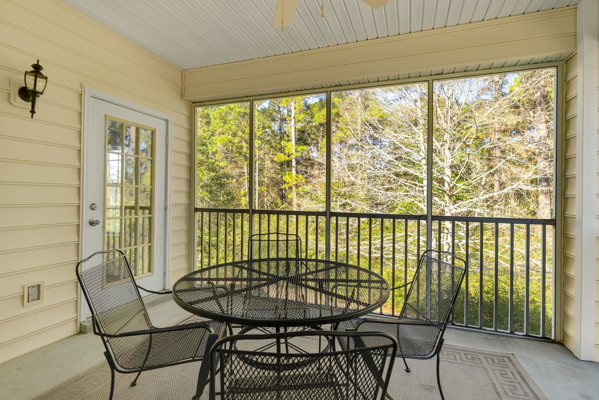 4499 Girvan Drive, Unit H Myrtle Beach, SC 29579 - Photo 31 of 35 Sunroom with ceiling fan and outdoor dining space