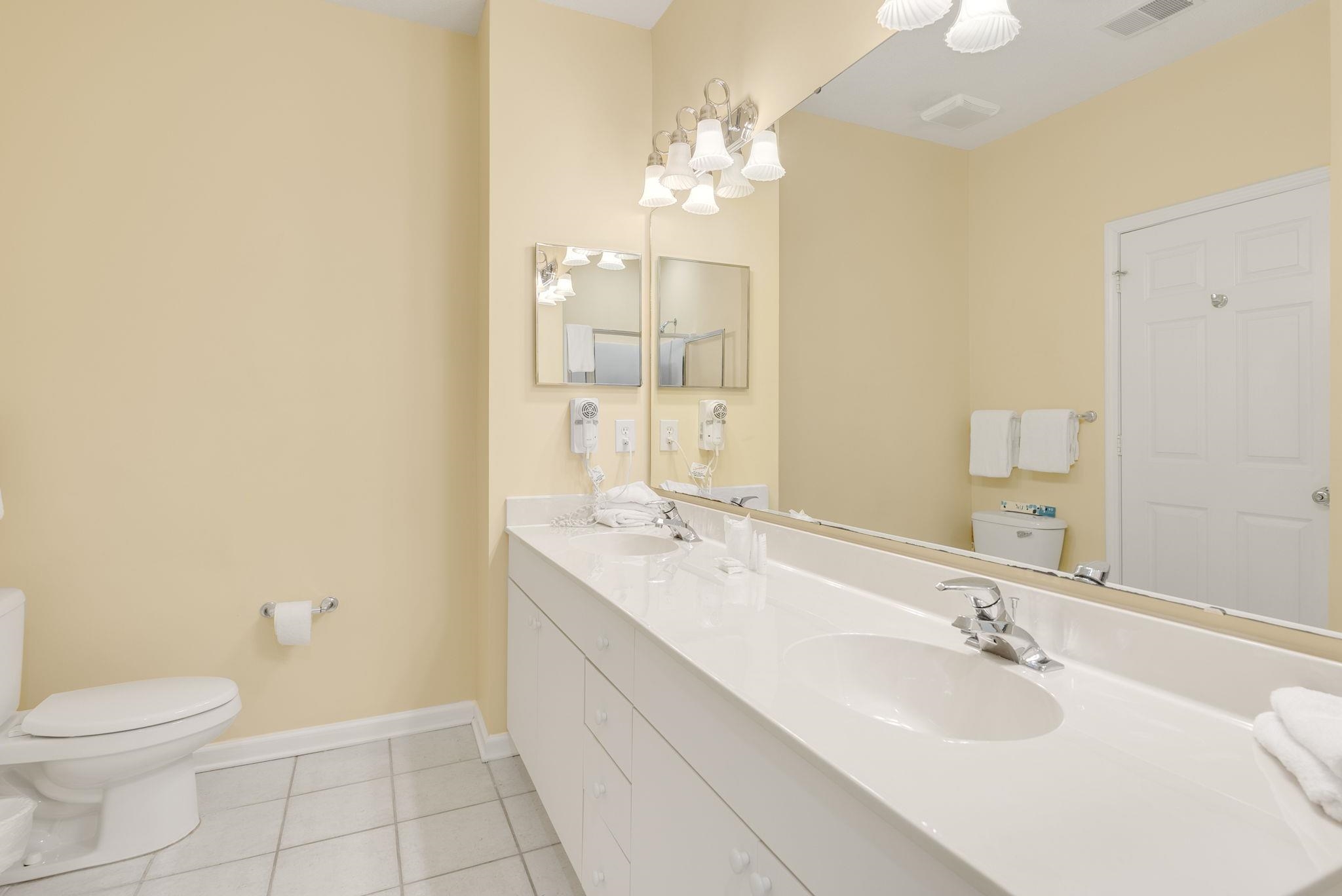 4499 Girvan Drive, Unit H Myrtle Beach, SC 29579 - Photo 34 of 35 Full bath with double vanity and light tile patterned flooring