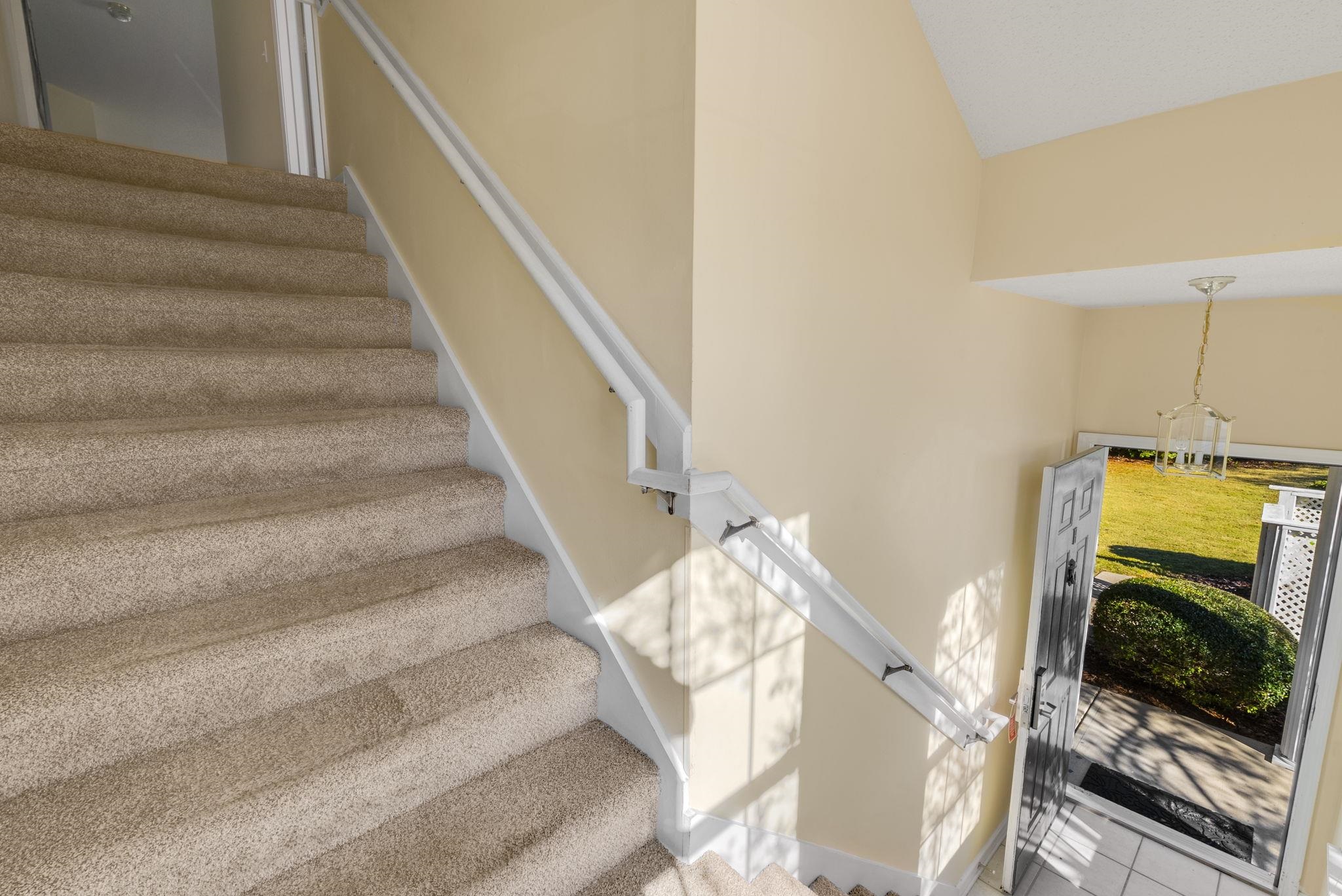 4499 Girvan Drive, Unit H Myrtle Beach, SC 29579 - Photo 7 of 35 Stairs with tile patterned flooring