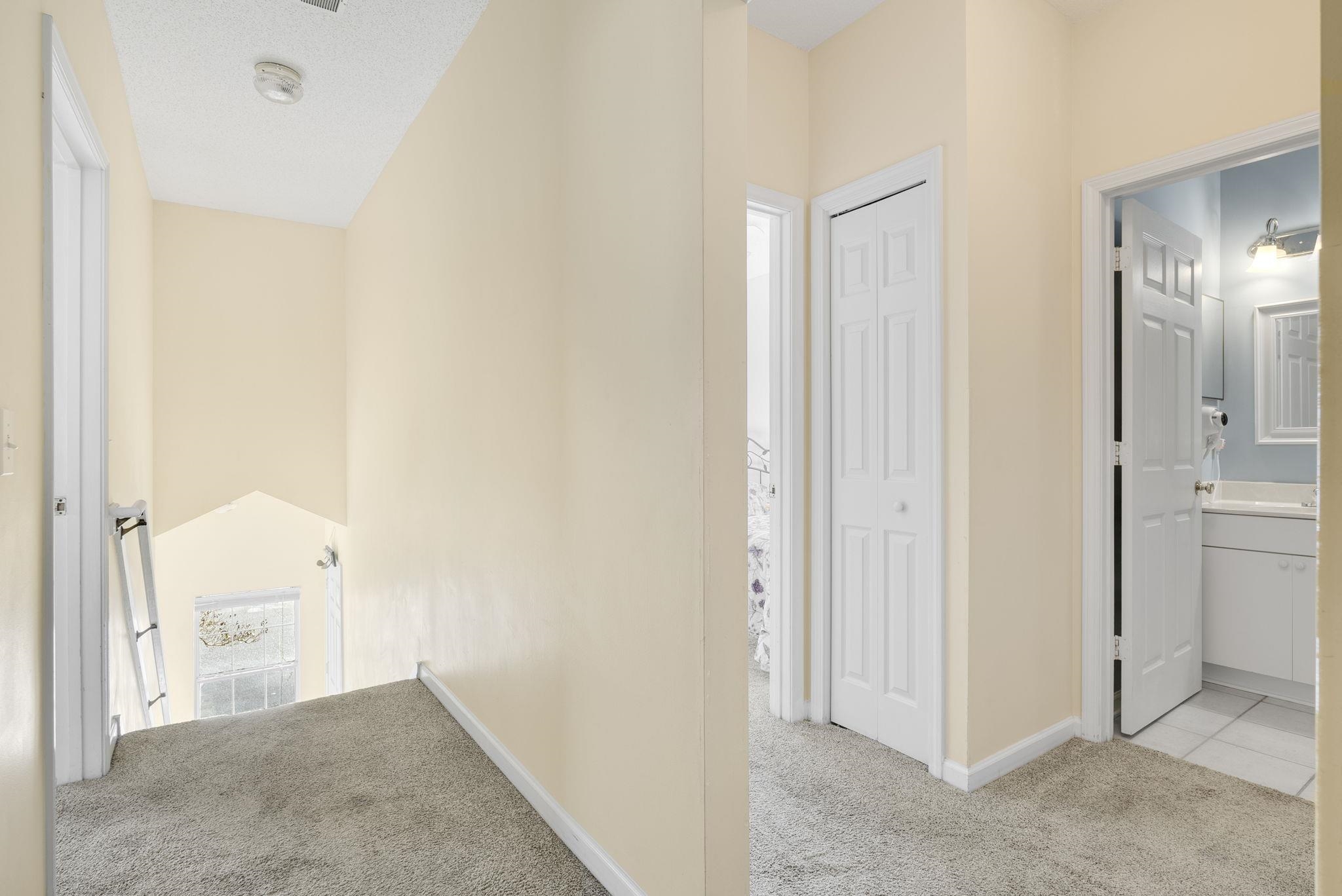 4499 Girvan Drive, Unit H Myrtle Beach, SC 29579 - Photo 8 of 35 Hall with light colored carpet and an upstairs landing