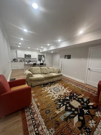 a living room with furniture and a rug