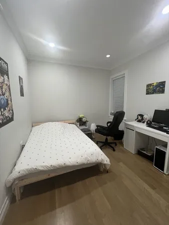 a bed room with a bed and furniture