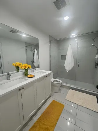 a kitchen with a sink appliances and cabinets