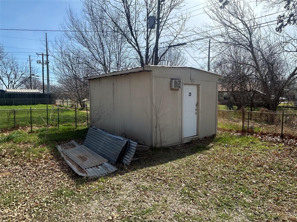 1438 Ave A Graham, TX 76450 - Photo 2 of 6 a view of a back yard of the house