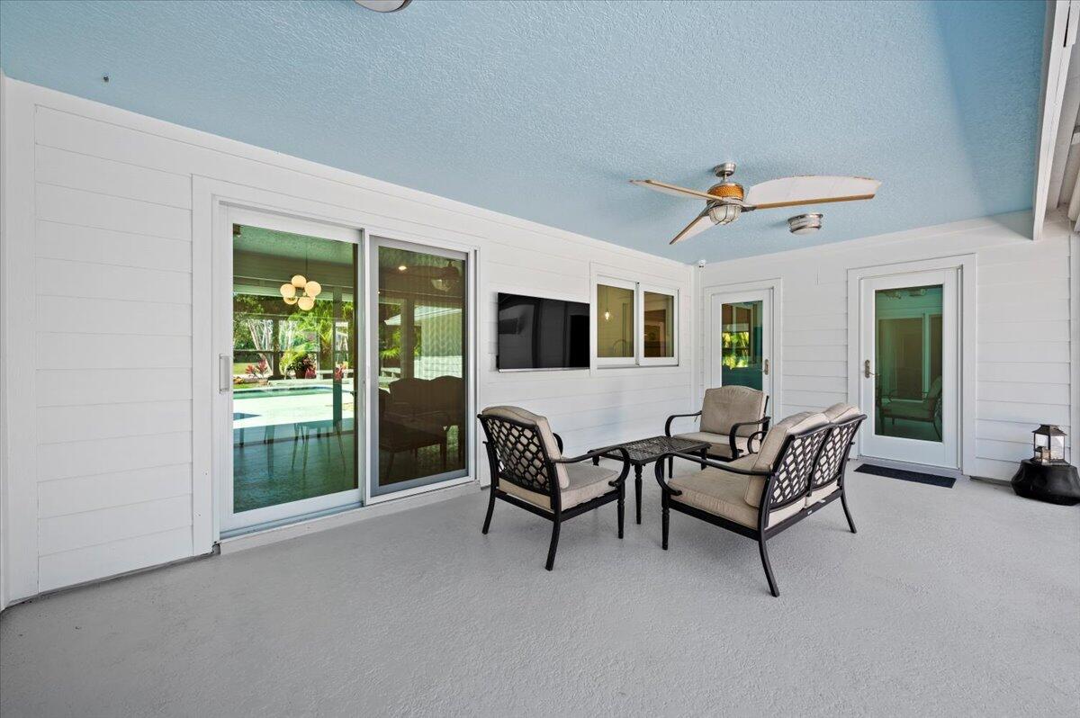 5776 Senegal Drive Jupiter, FL 33458 - Photo 31 of 57 back patio with cabana bathroom