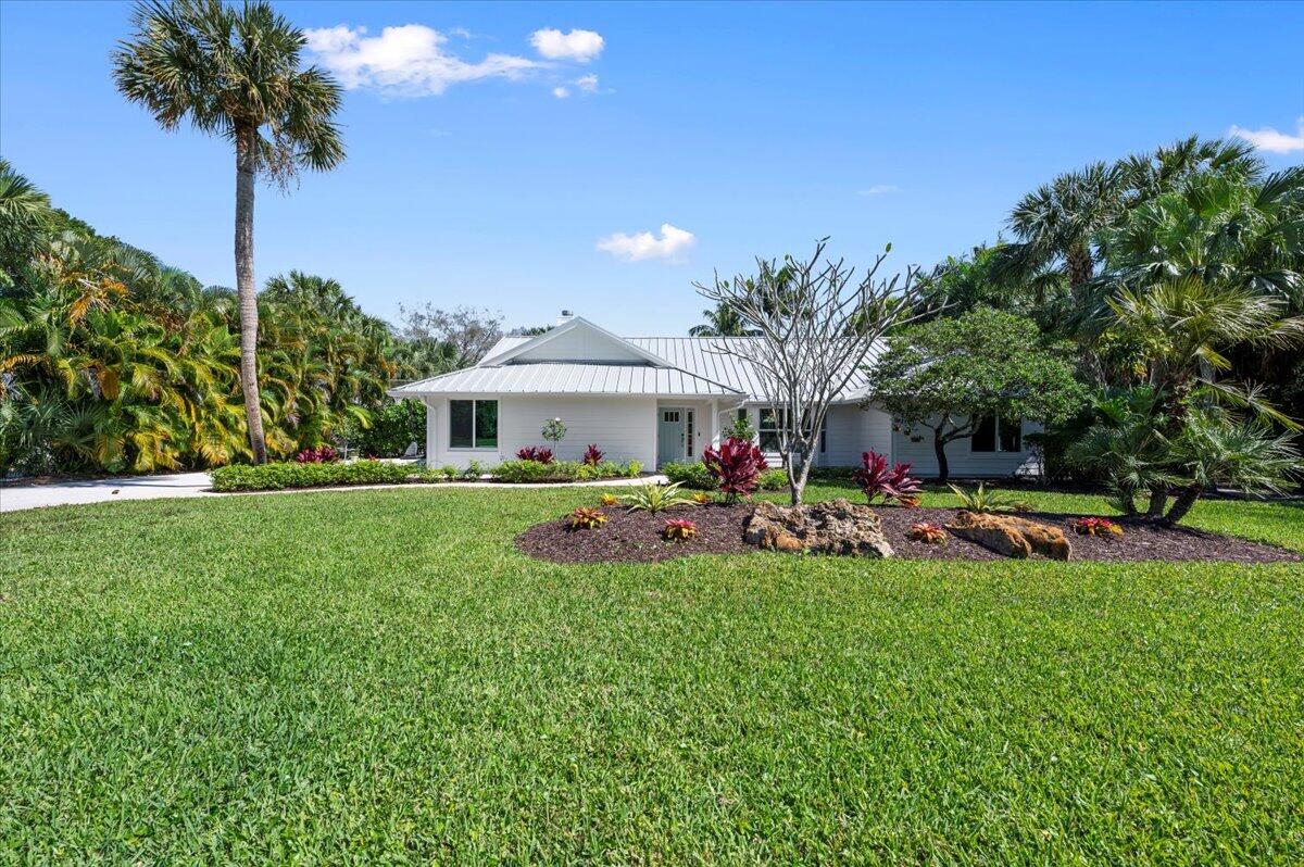 5776 Senegal Drive Jupiter, FL 33458 - Photo 5 of 57 front yard