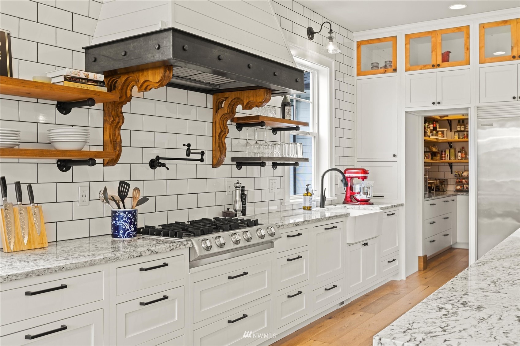 8209 Spada Road Snohomish, WA 98290 - Photo 13 of 39 a kitchen with stainless steel appliances cabinets a stove and a window