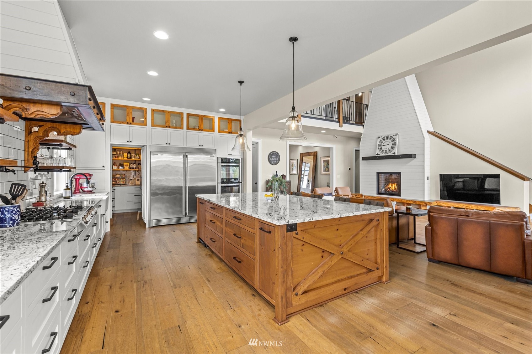 8209 Spada Road Snohomish, WA 98290 - Photo 14 of 39 a kitchen with stainless steel appliances granite countertop a sink and wooden cabinets