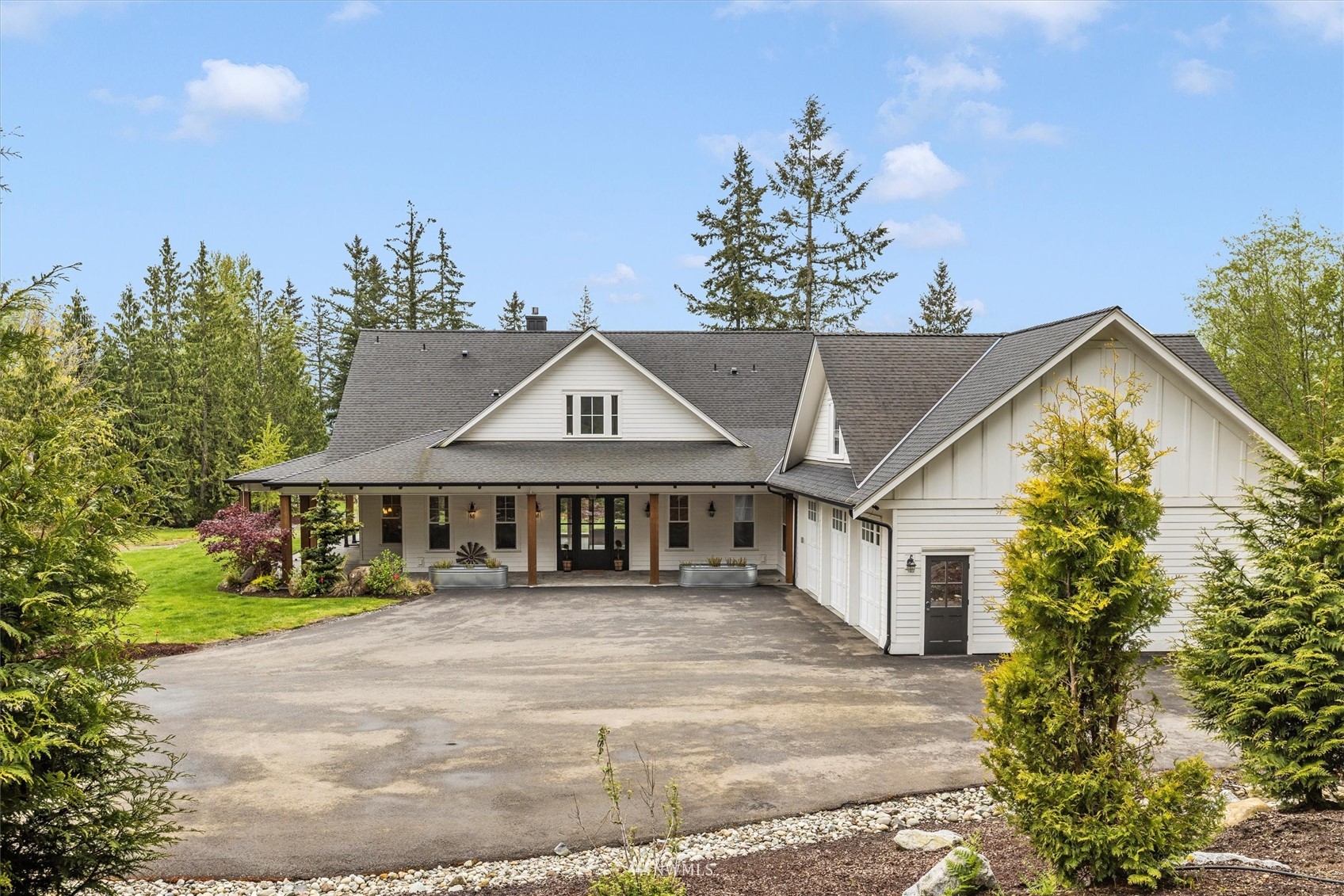 8209 Spada Road Snohomish, WA 98290 - Photo 2 of 39 a view of a house with a yard and potted plants