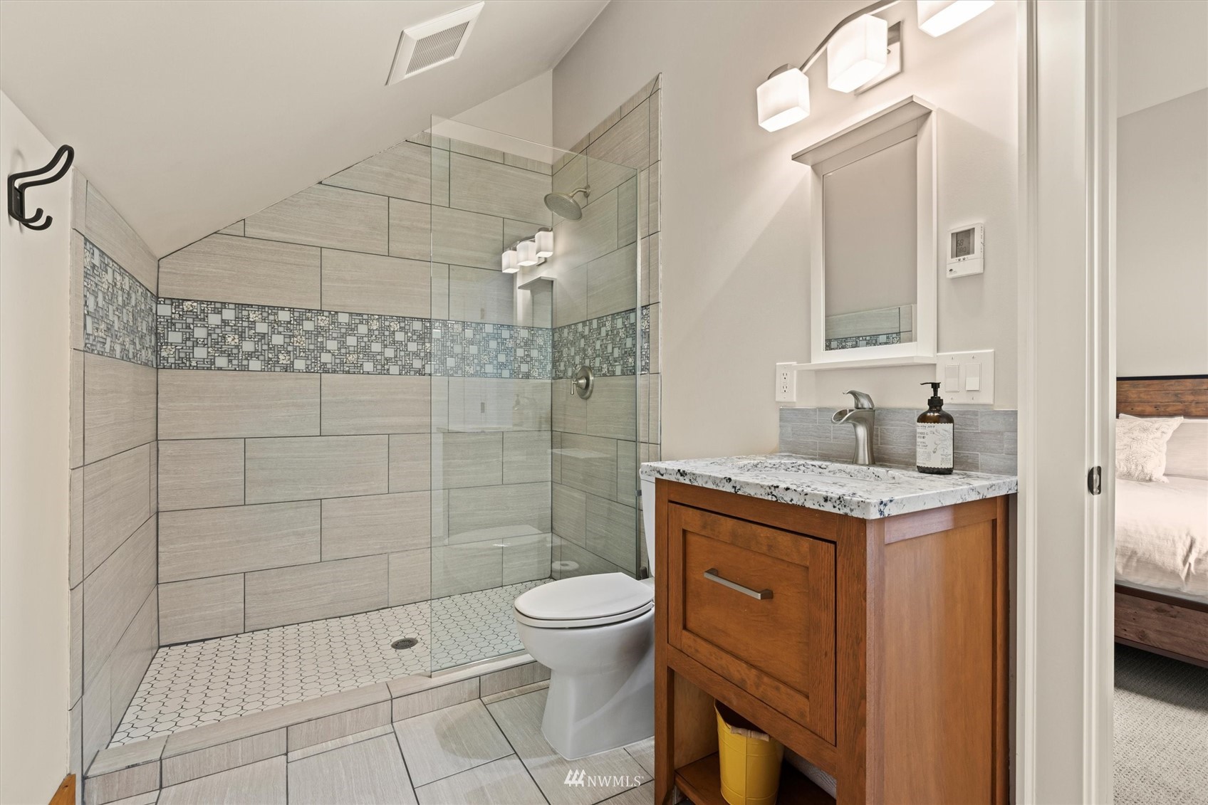 8209 Spada Road Snohomish, WA 98290 - Photo 27 of 39 a bathroom with a granite countertop sink a toilet and shower