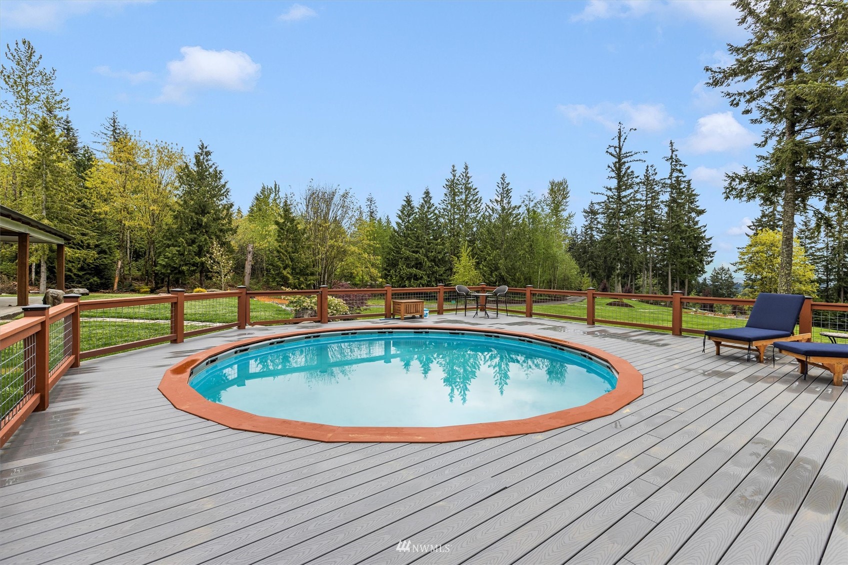 8209 Spada Road Snohomish, WA 98290 - Photo 33 of 39 a view of a swimming pool with a lounge chairs