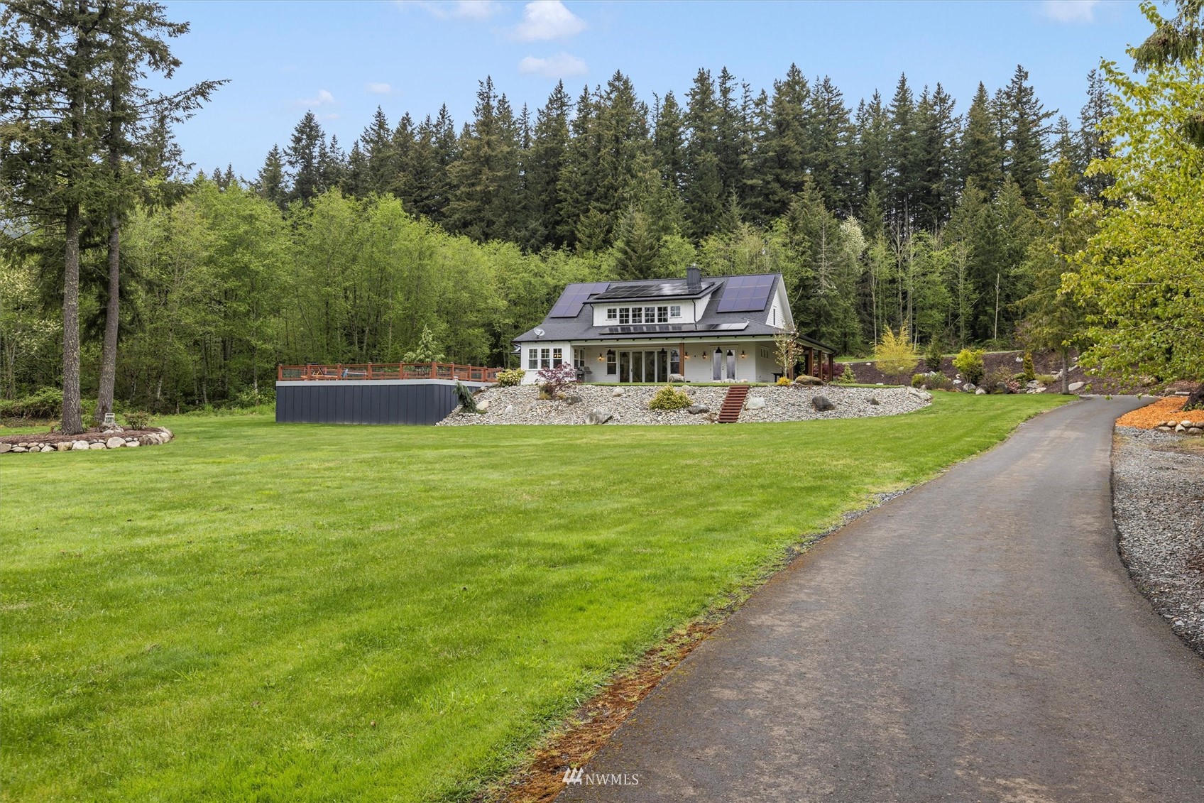 8209 Spada Road Snohomish, WA 98290 - Photo 35 of 39 a view of a house with a yard porch and sitting area