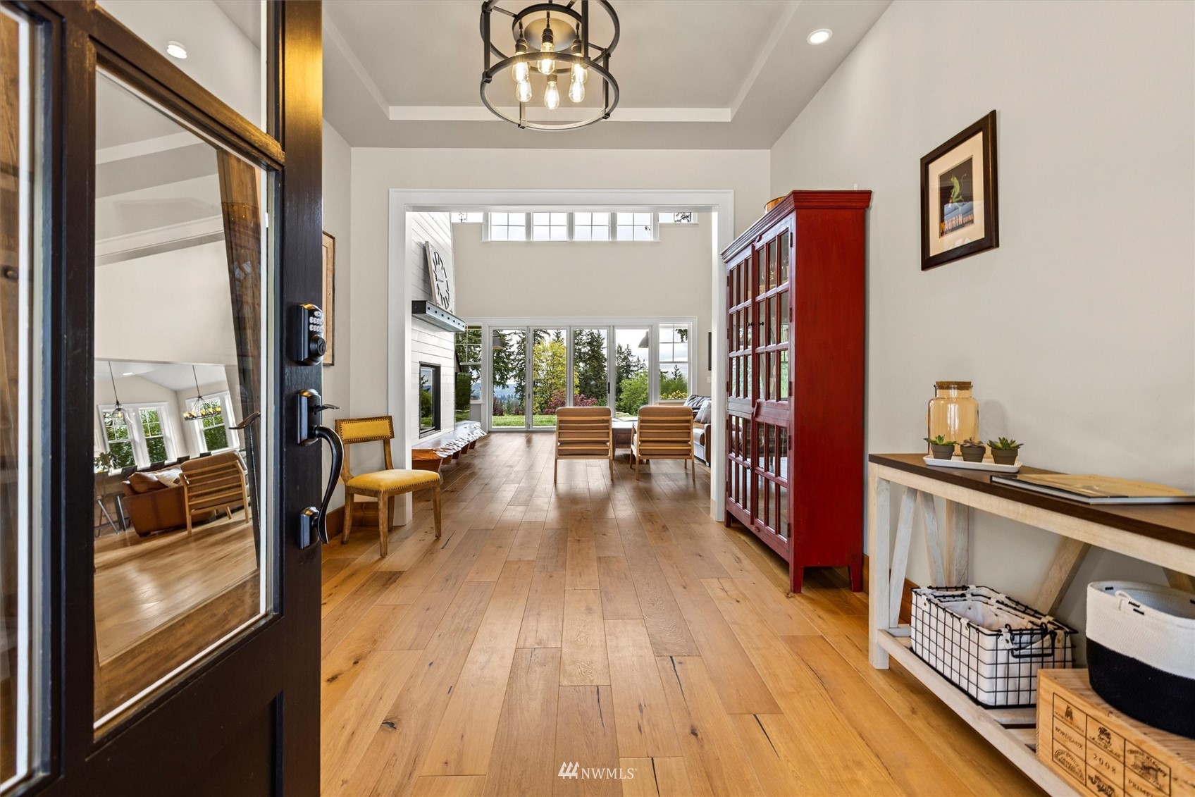 8209 Spada Road Snohomish, WA 98290 - Photo 5 of 39 a view of a hallway with wooden floor