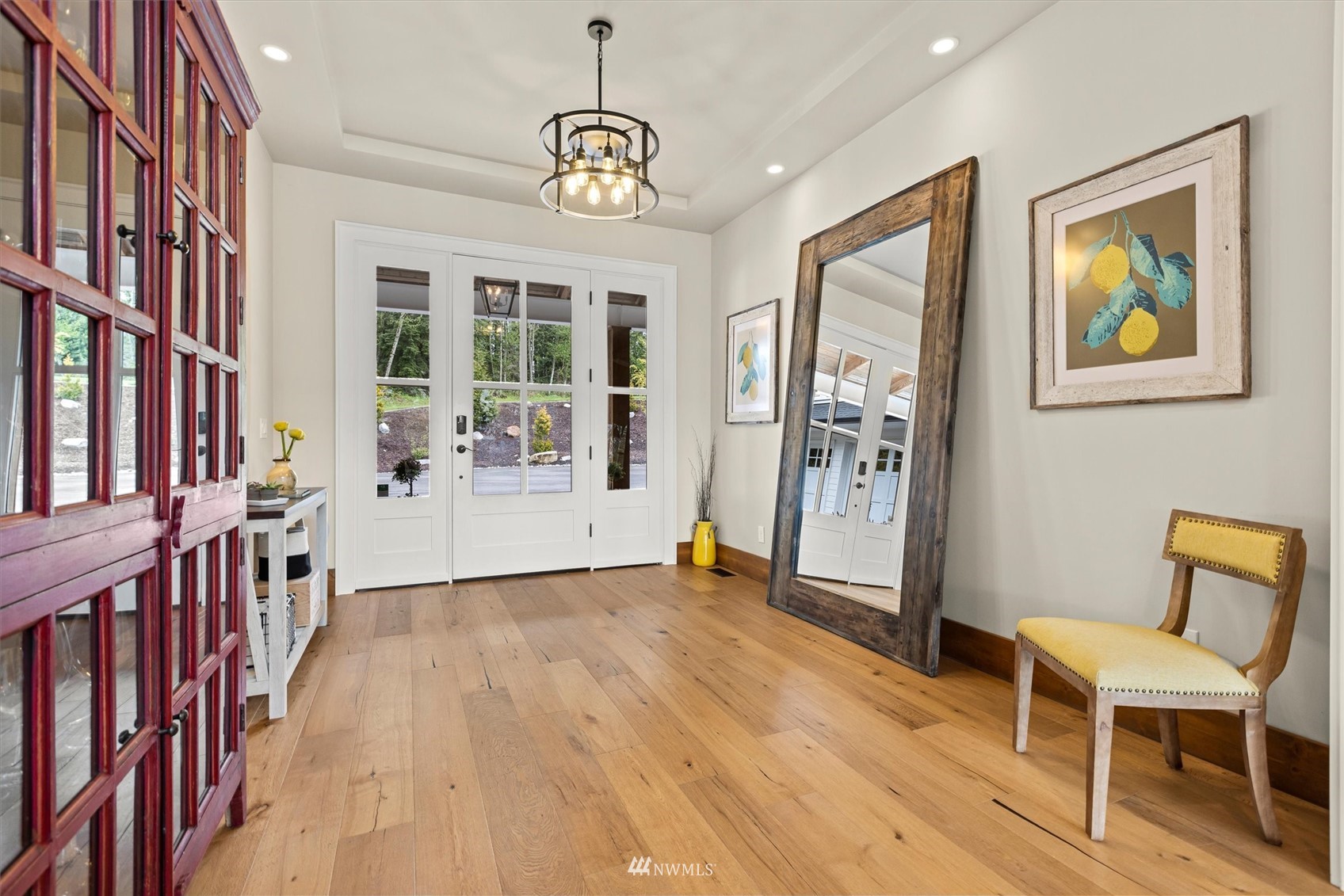 8209 Spada Road Snohomish, WA 98290 - Photo 6 of 39 a view of livingroom with furniture wooden floor and windows