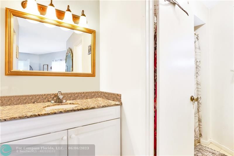 1128 Hernando Street Fort Pierce, FL 34949 - Photo 11 of 46 a bathroom with a sink and a mirror