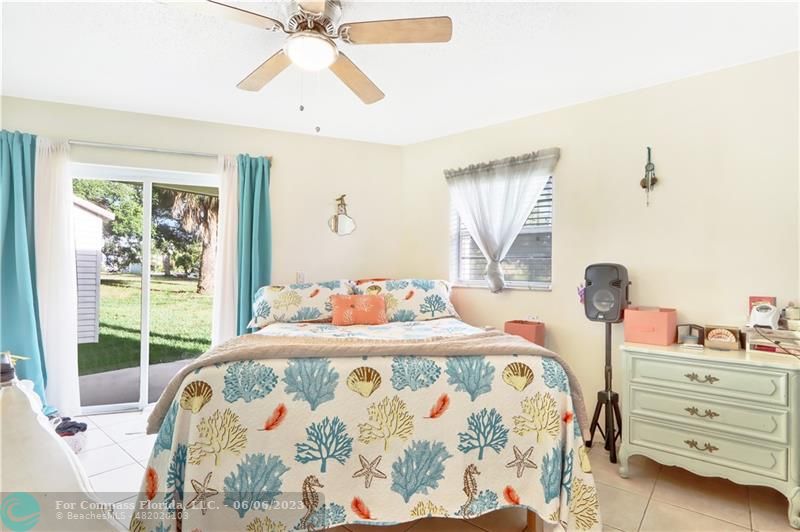 1128 Hernando Street Fort Pierce, FL 34949 - Photo 12 of 46 a bedroom with a bed and a window