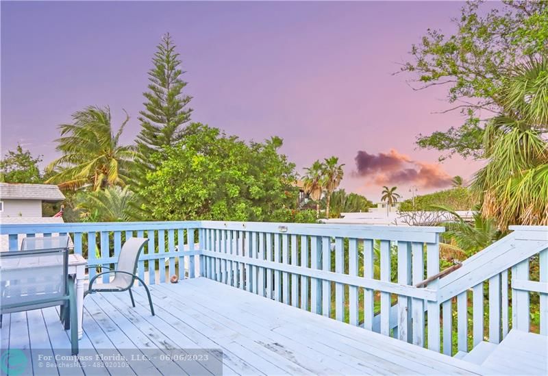 1128 Hernando Street Fort Pierce, FL 34949 - Photo 20 of 46 a view of a chair and table on the wooden floor