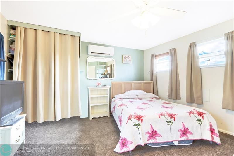 1128 Hernando Street Fort Pierce, FL 34949 - Photo 22 of 46 a bedroom with a bed and a window