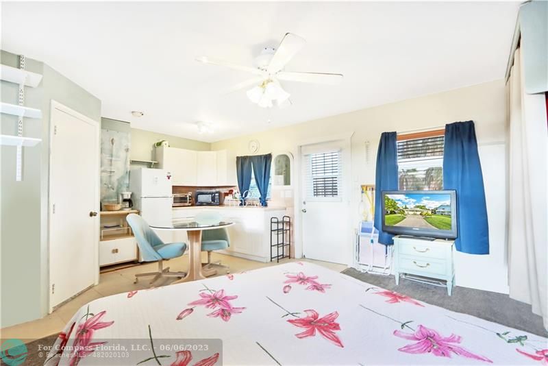 1128 Hernando Street Fort Pierce, FL 34949 - Photo 23 of 46 a bed room with a bed a window and dresser