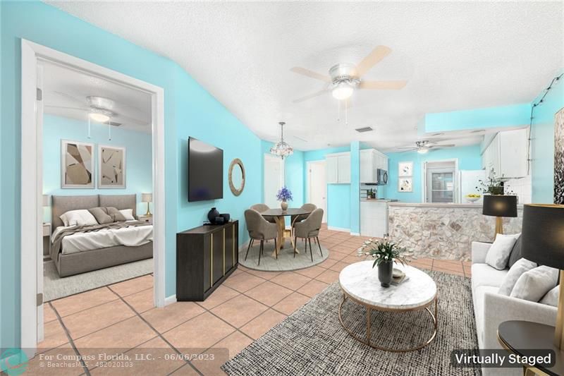 1128 Hernando Street Fort Pierce, FL 34949 - Photo 26 of 46 a living room with furniture and a flat screen tv