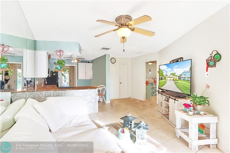 1128 Hernando Street Fort Pierce, FL 34949 - Photo 3 of 46 a living room with furniture and a flat screen tv