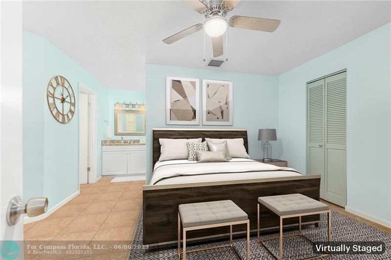 1128 Hernando Street Fort Pierce, FL 34949 - Photo 31 of 46 a bedroom with a bed and a table in it