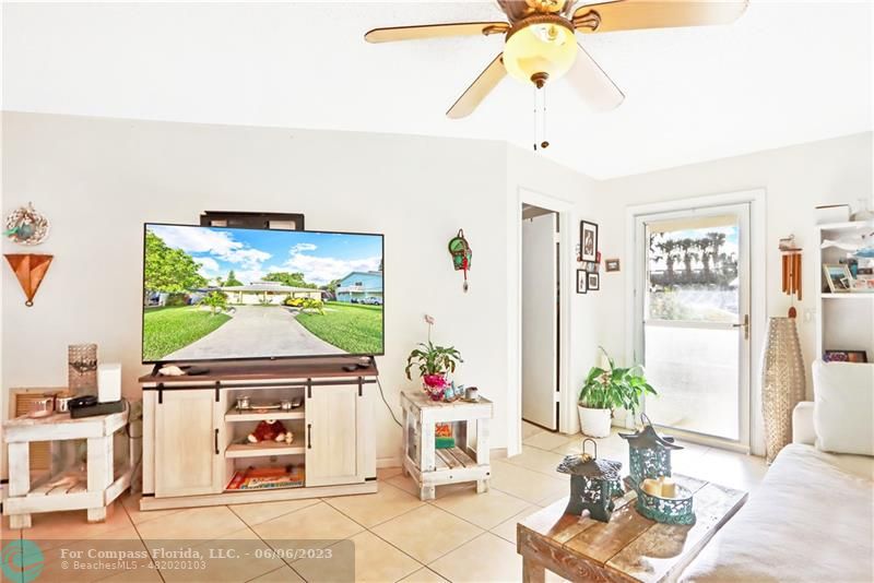 1128 Hernando Street Fort Pierce, FL 34949 - Photo 4 of 46 a living room with furniture and a chandelier