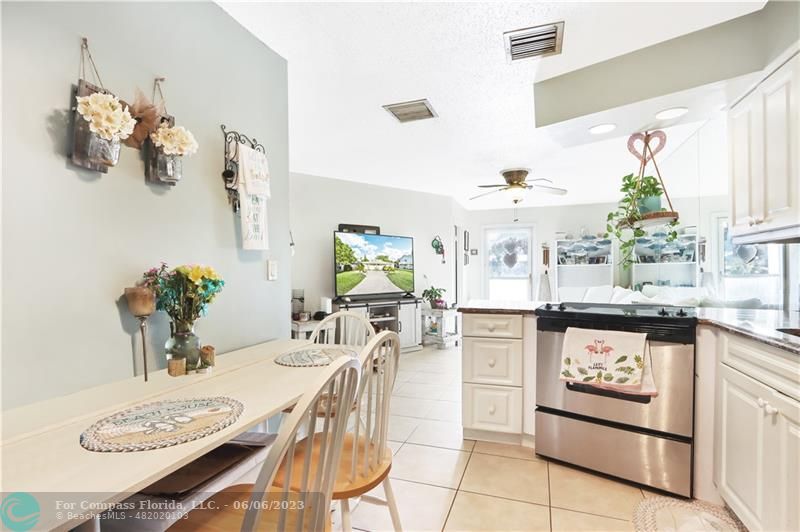 1128 Hernando Street Fort Pierce, FL 34949 - Photo 6 of 46 a kitchen with a table and chairs in it