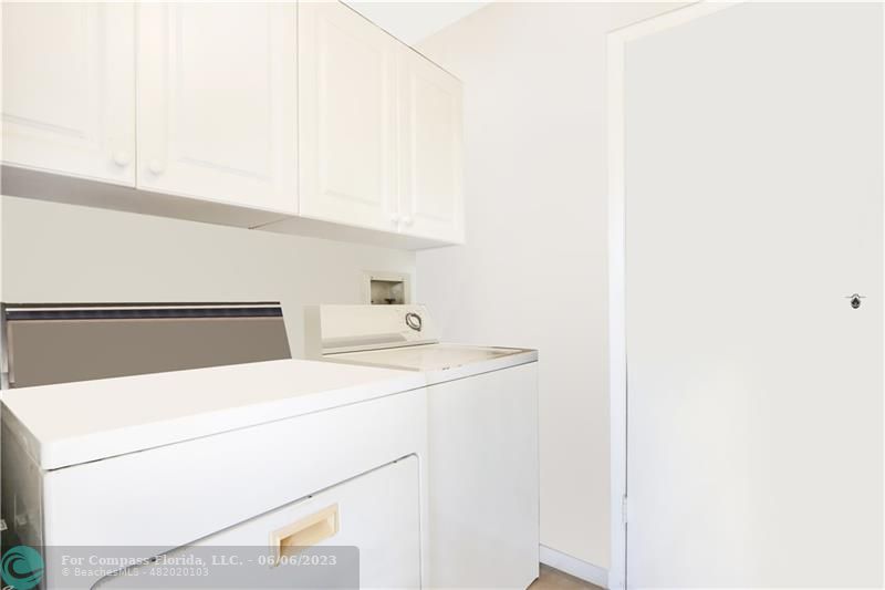 1128 Hernando Street Fort Pierce, FL 34949 - Photo 8 of 46 a utility room with dryer and washer