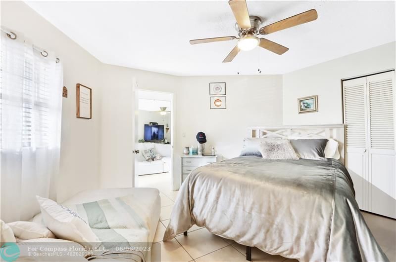 1128 Hernando Street Fort Pierce, FL 34949 - Photo 10 of 46 a bedroom with a bed and a couch