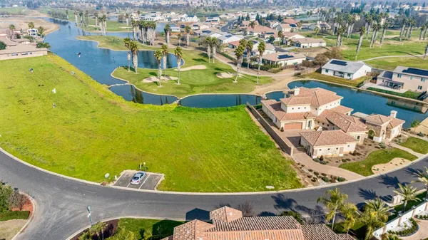 a view of a swimming pool with a lawn chairs