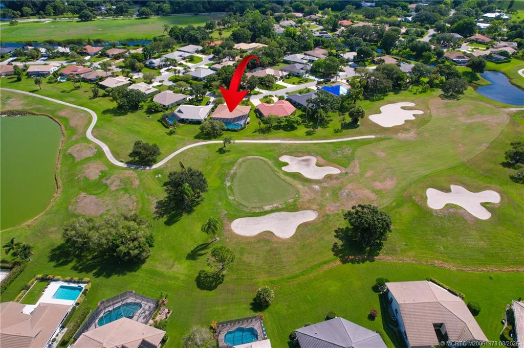 2284 Southwest Spoonbill Drive Palm City, FL 34990 - Photo 29 of 30 an aerial view of a golf course with a lake view