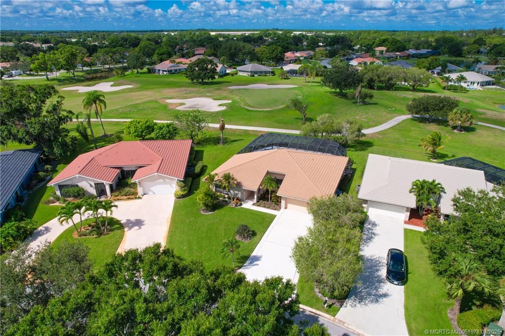 2284 Southwest Spoonbill Drive Palm City, FL 34990 - Photo 30 of 30 an aerial view of a house with yard