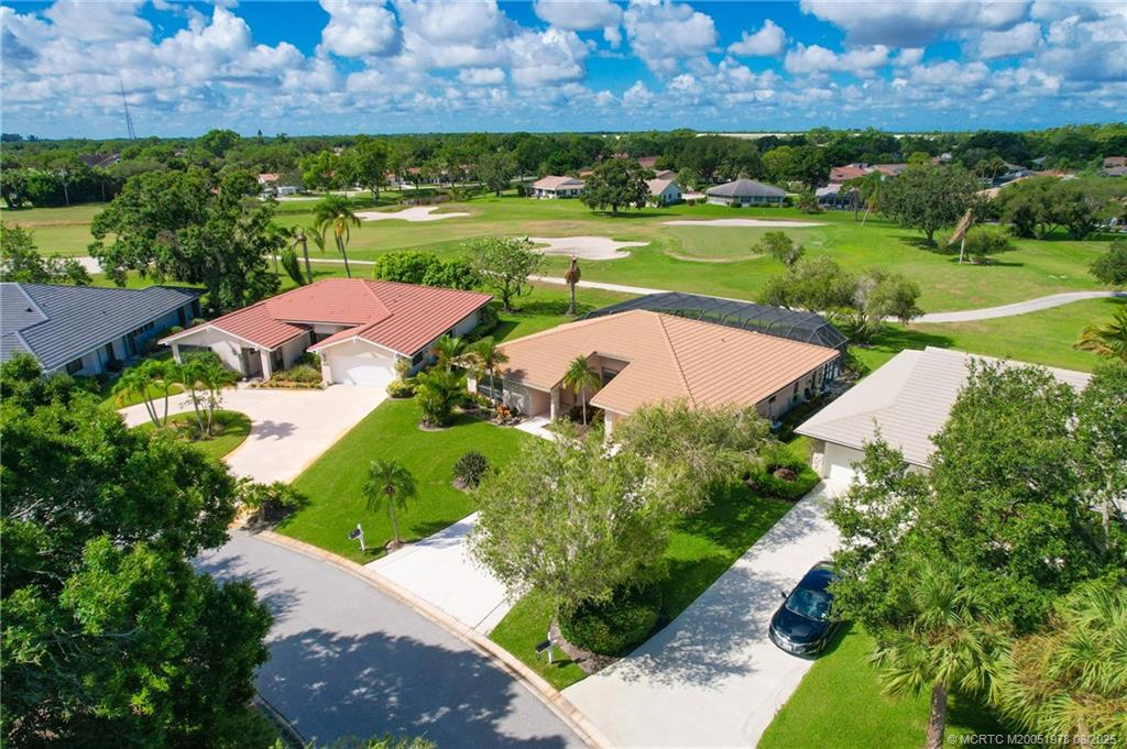 2284 Southwest Spoonbill Drive Palm City, FL 34990 - Photo 7 of 30 an aerial view of a houses with outdoor space and street view