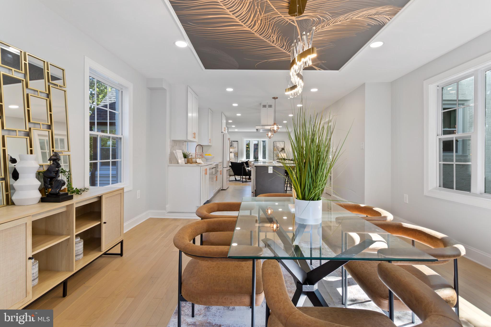617 Greenbrier Drive Silver Spring, MD 20910 - Photo 18 of 70 a view of a dining room with furniture and a potted plant