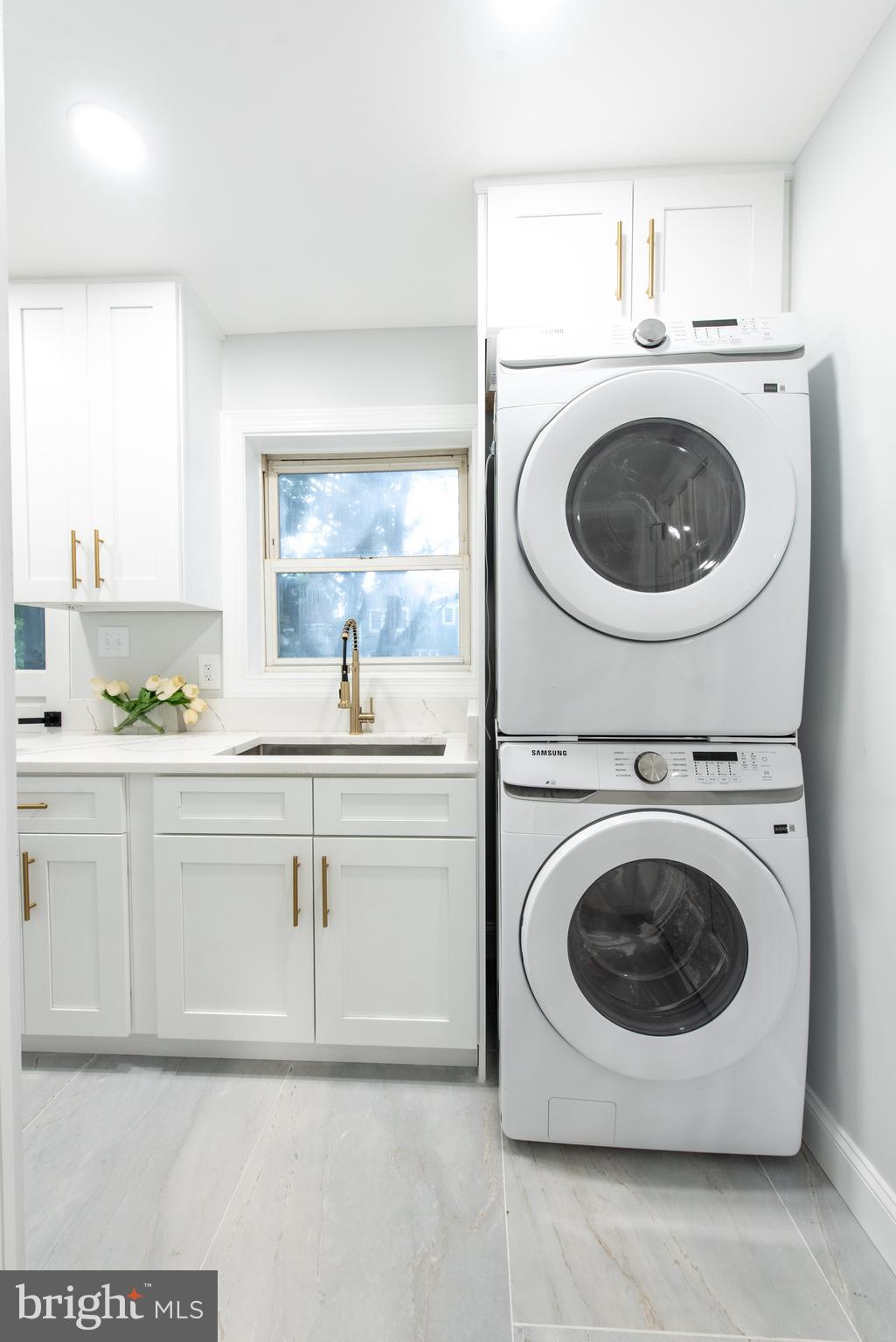 617 Greenbrier Drive Silver Spring, MD 20910 - Photo 27 of 70 a utility room with sink washer and dryer