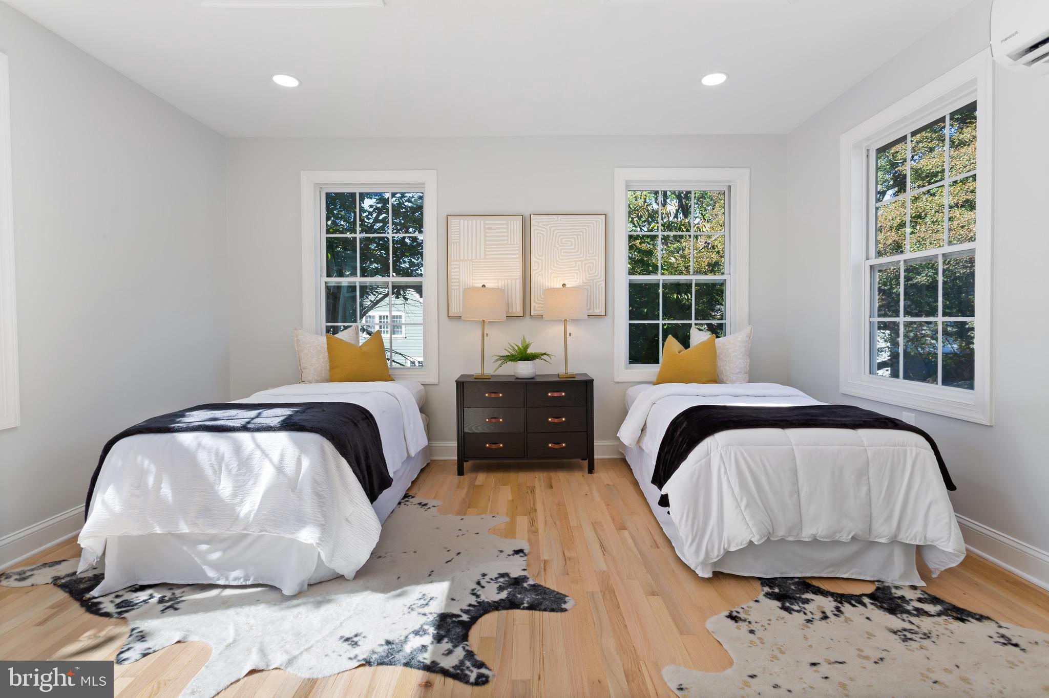 617 Greenbrier Drive Silver Spring, MD 20910 - Photo 46 of 70 a bedroom with a bed and wooden floor