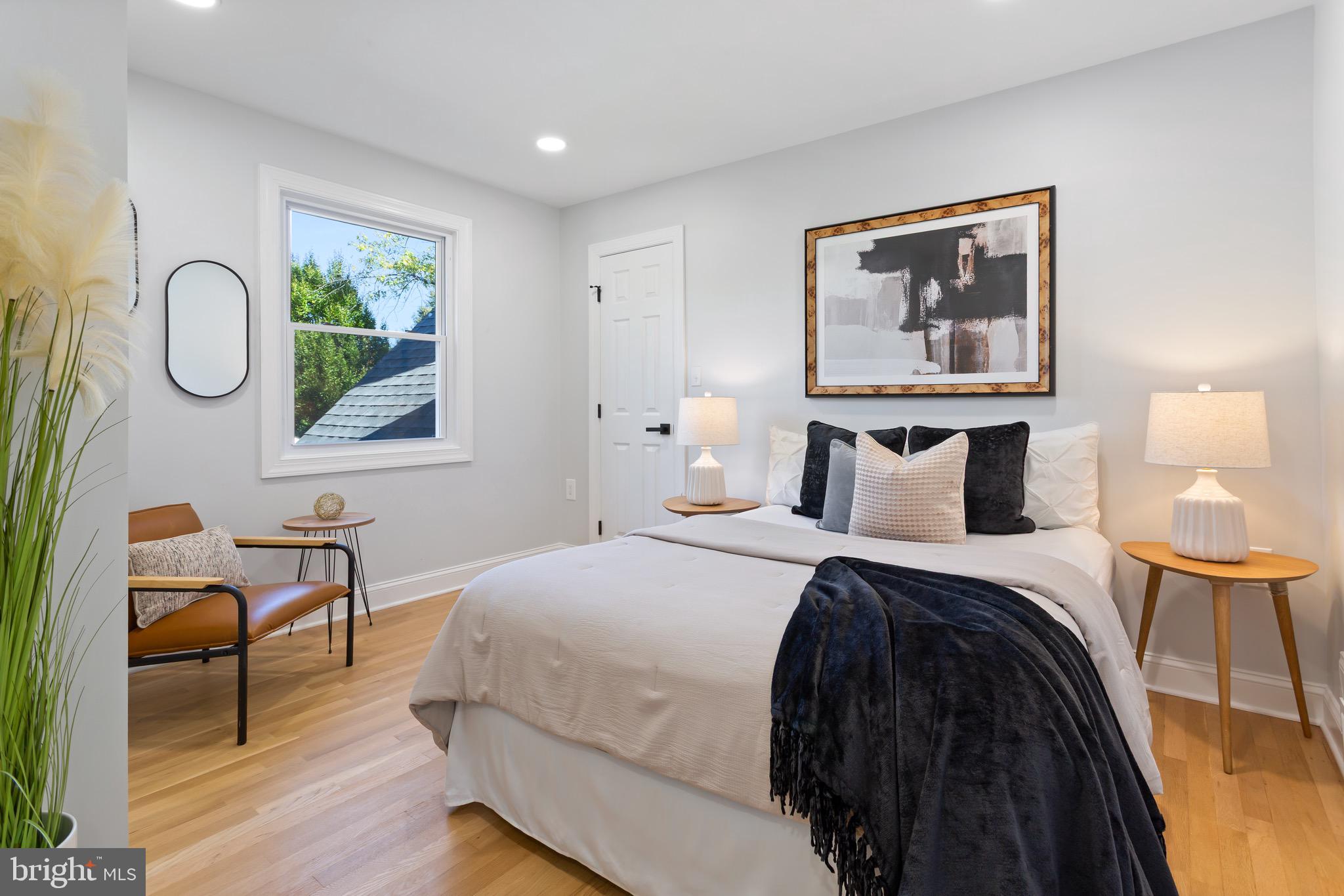 617 Greenbrier Drive Silver Spring, MD 20910 - Photo 48 of 70 a bedroom with a bed and a lamp next to a window
