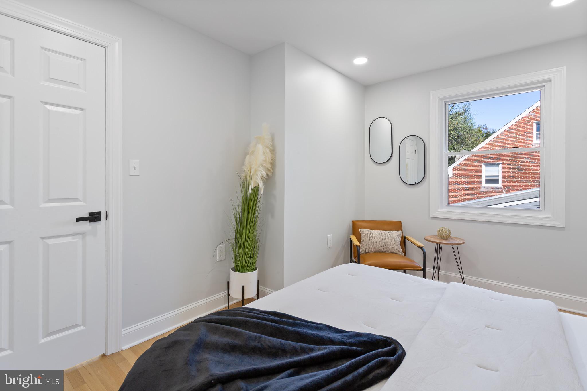 617 Greenbrier Drive Silver Spring, MD 20910 - Photo 49 of 70 a bedroom with a bed and chandelier