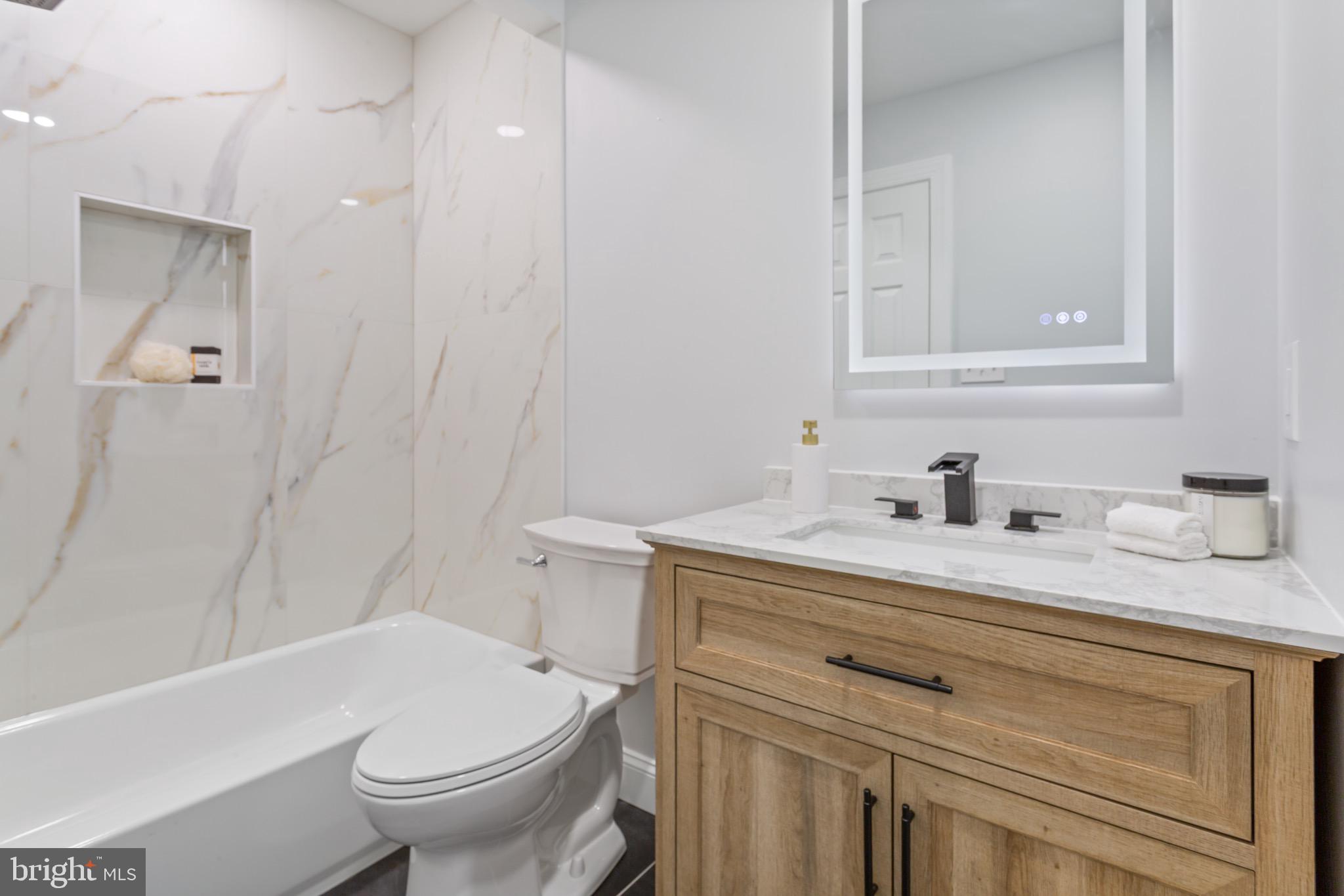 617 Greenbrier Drive Silver Spring, MD 20910 - Photo 56 of 70 a bathroom with a granite countertop sink toilet and shower