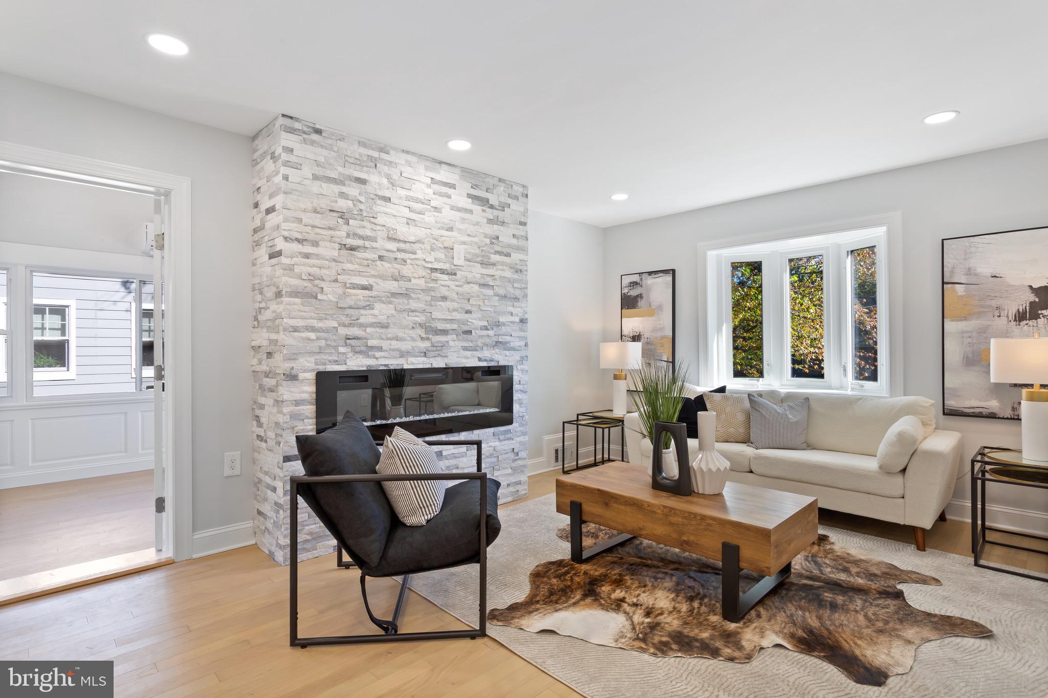 617 Greenbrier Drive Silver Spring, MD 20910 - Photo 6 of 70 a living room with furniture and a fireplace