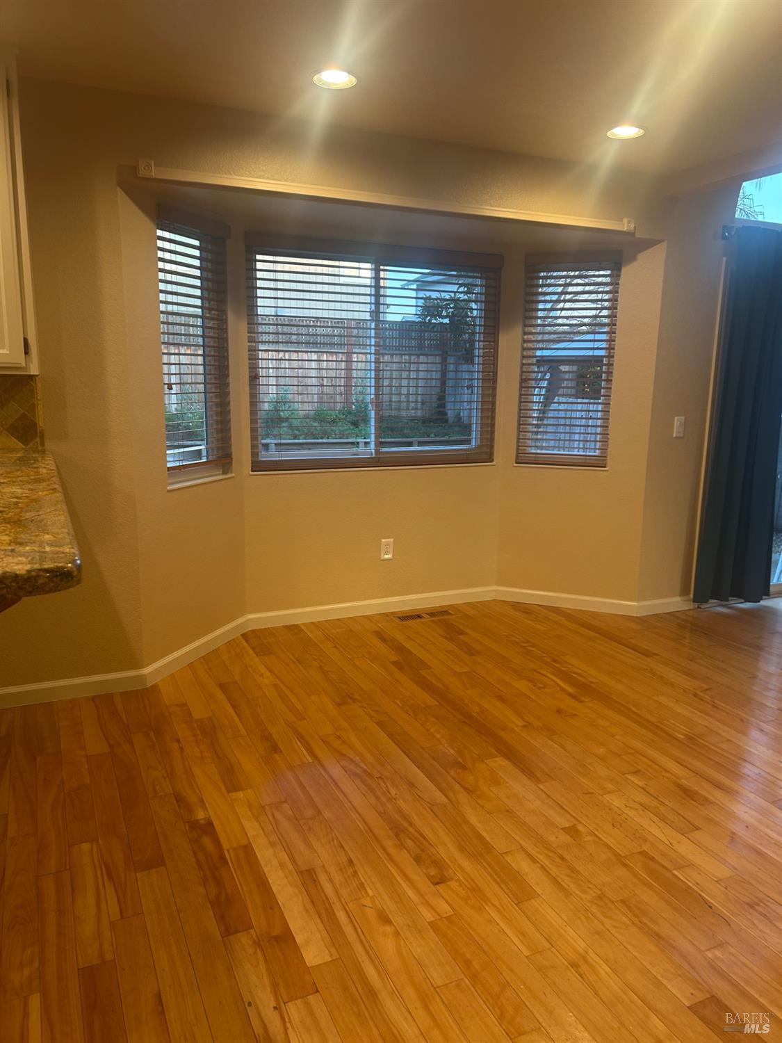 7536 Mercedes Way Rohnert Park, CA 94928 - Photo 3 of 11 a view of empty room with wooden floor and fan