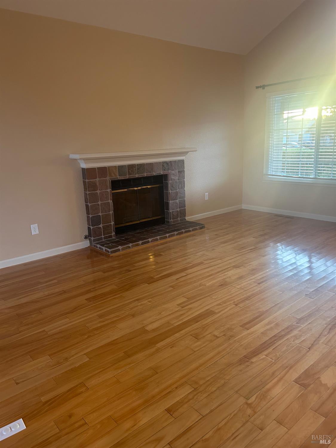 7536 Mercedes Way Rohnert Park, CA 94928 - Photo 4 of 11 an empty room with wooden floor and windows