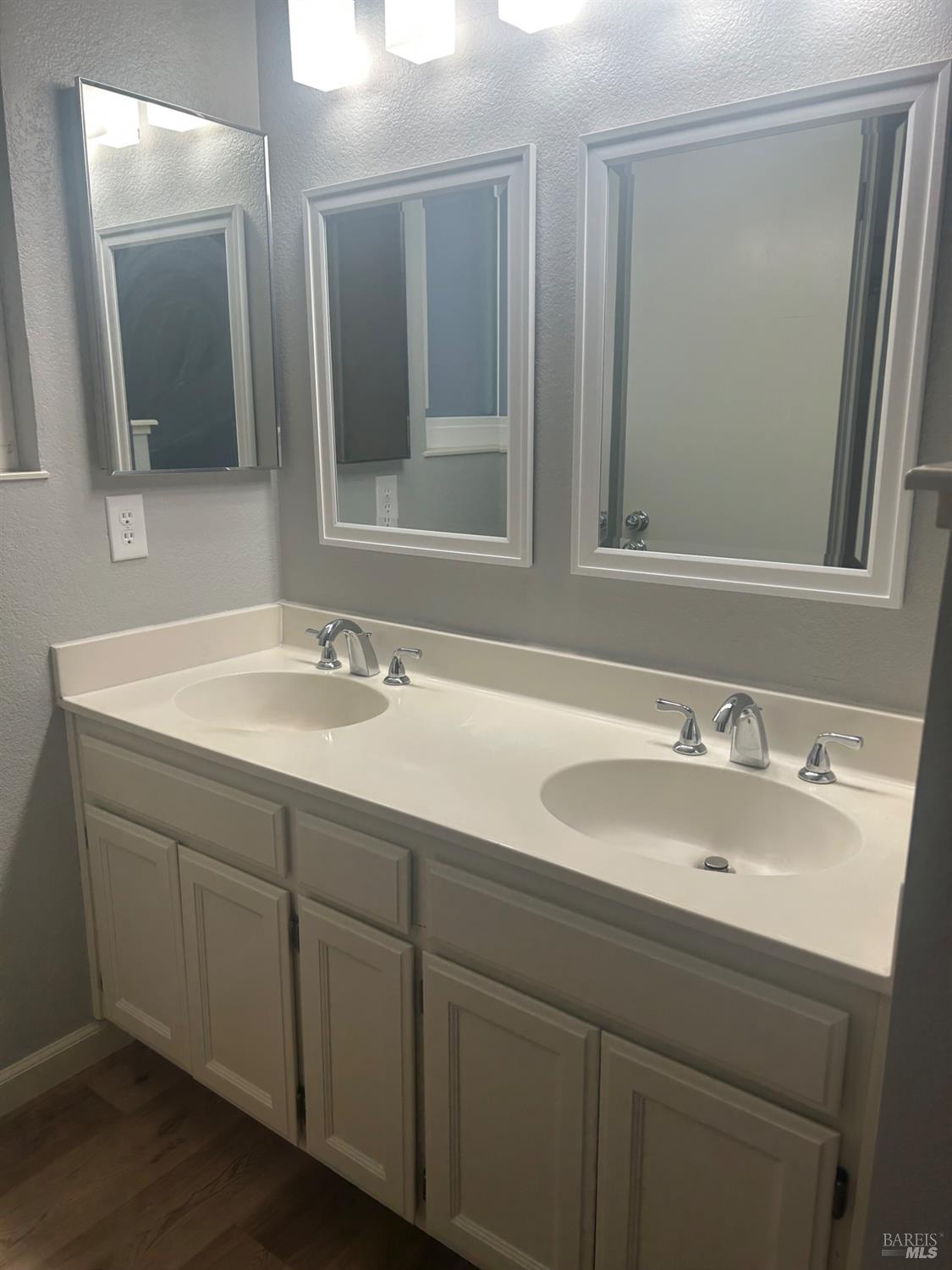 7536 Mercedes Way Rohnert Park, CA 94928 - Photo 5 of 11 a bathroom with a sink and a mirror