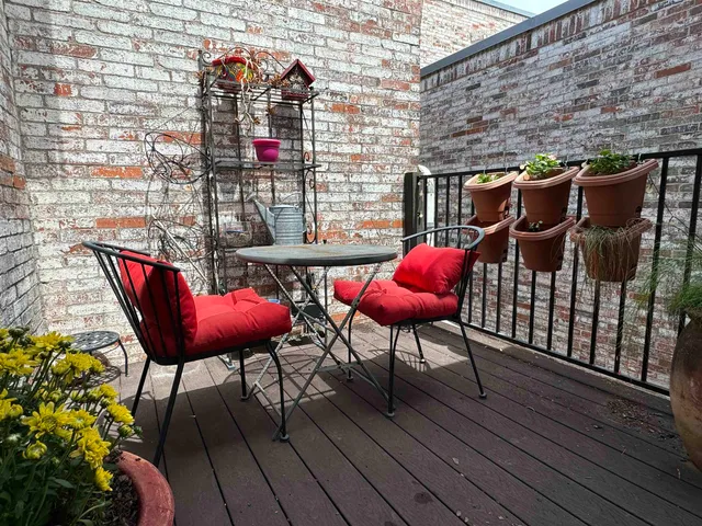 a view of a chairs on the roof deck